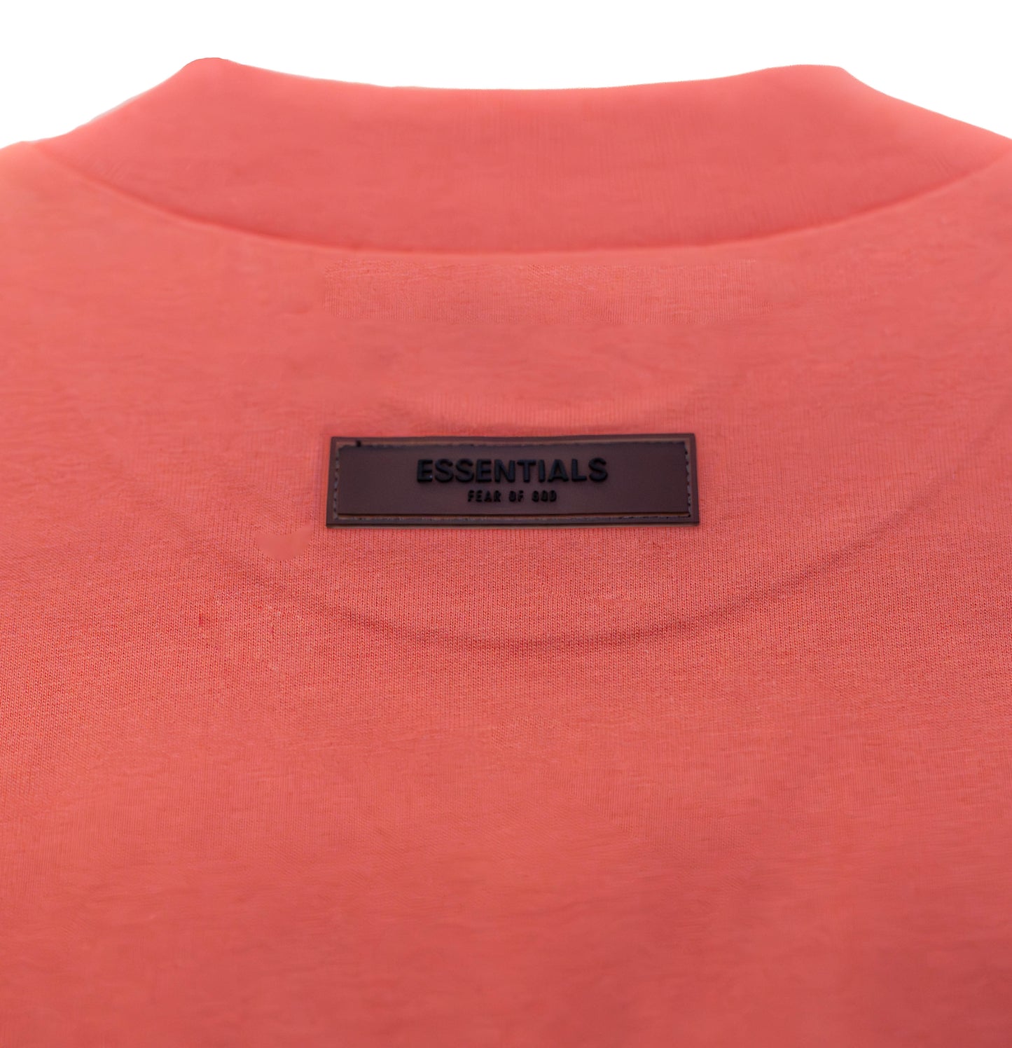 Fear of God Essentials Tee in the “Coral” Colorway